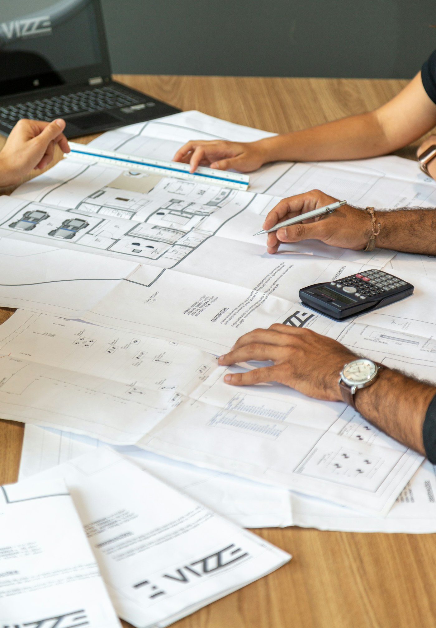 Project team reviewing architectural plans